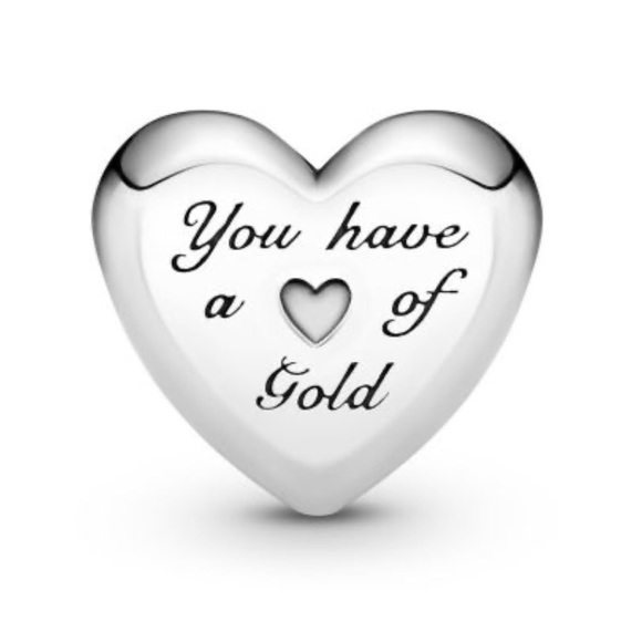 in 925 sterling silver, this heart shaped piece includes a 14k gold heart. - Picture 2 of 2